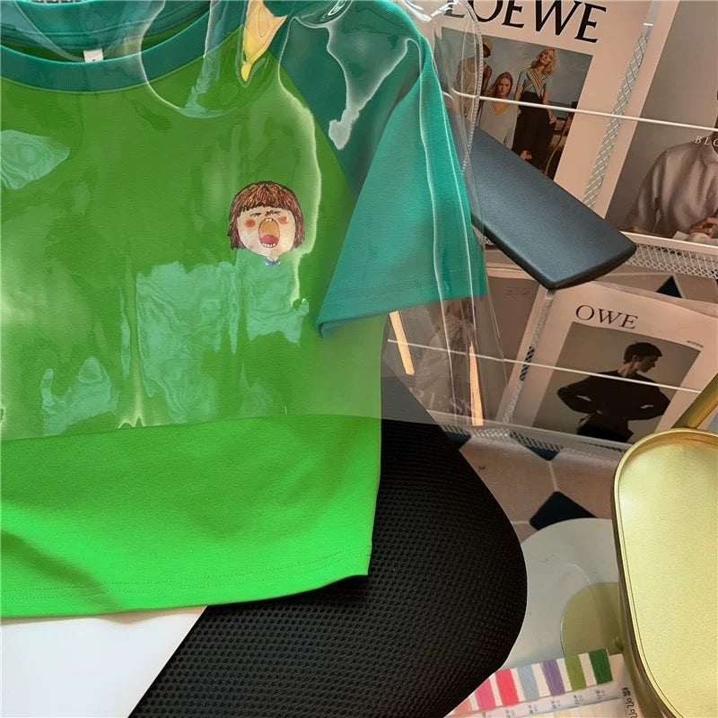 T-ShirtGreen Graphic Tee – Cartoon Yawning Girl Print