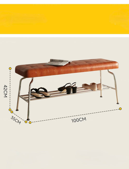 Brown leather bench with metal shelf and dimensions on a beige background
