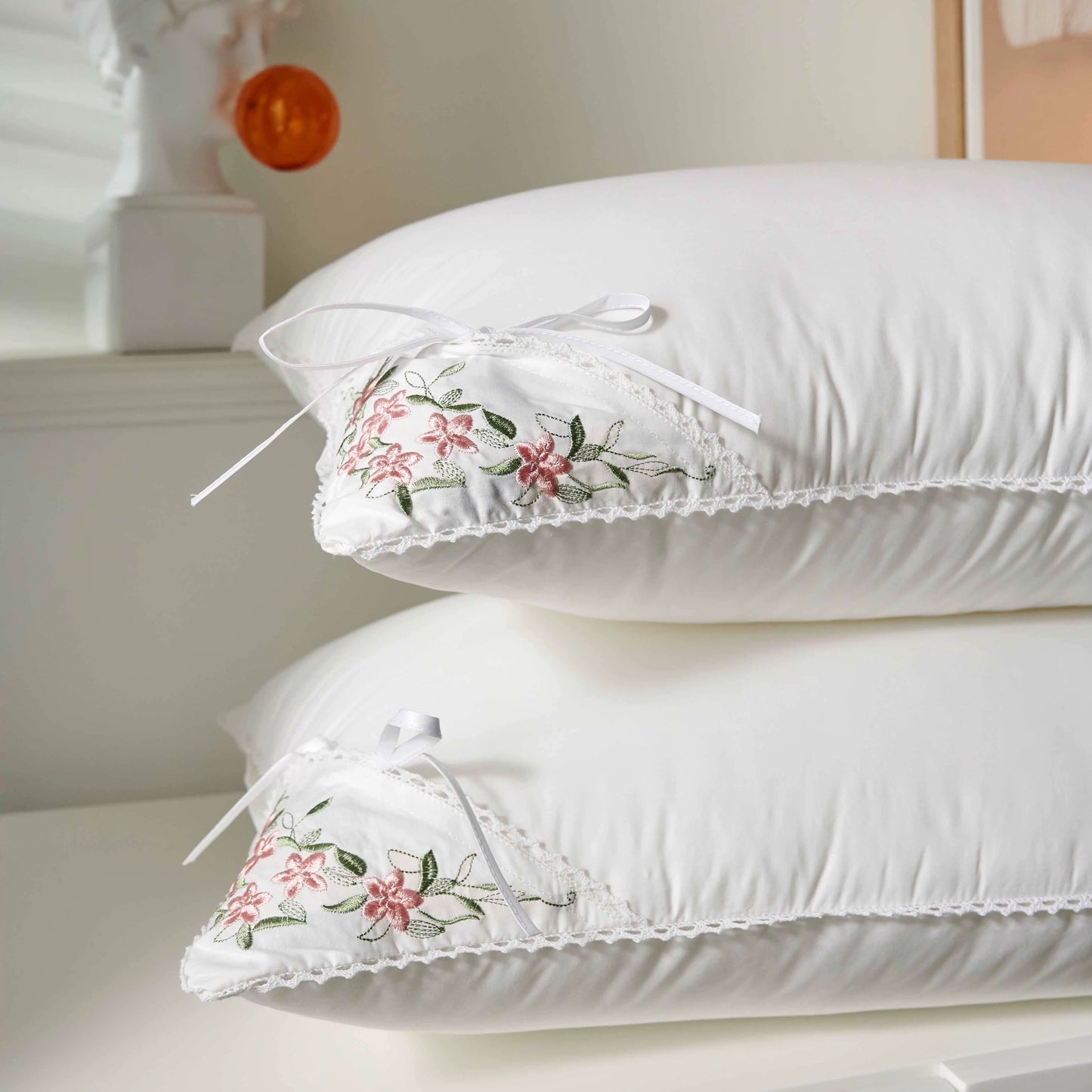 White Pillowcases with Floral Embroidery an Lace Trim