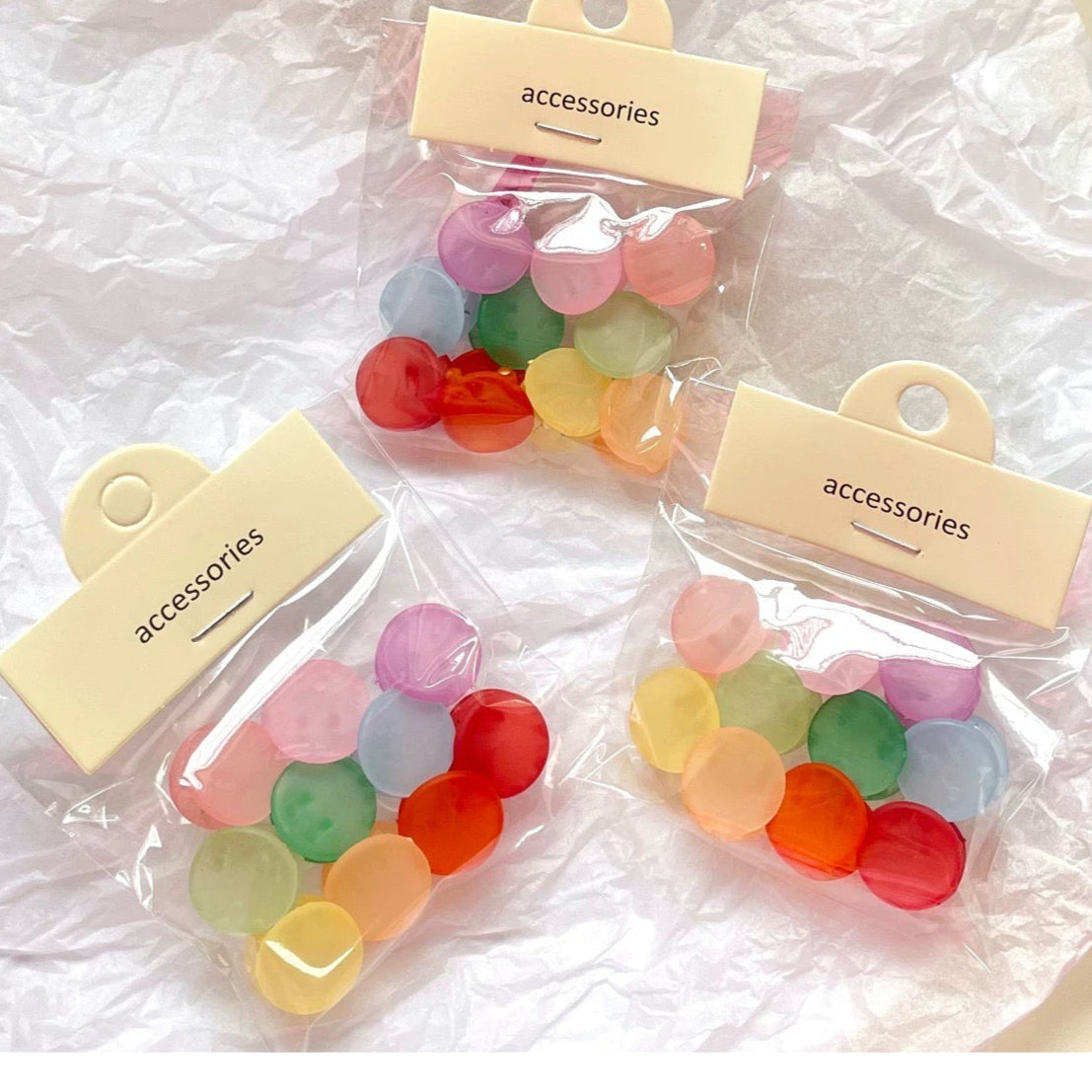 Colorful accessories in clear packaging with 'accessories' labels on a white background