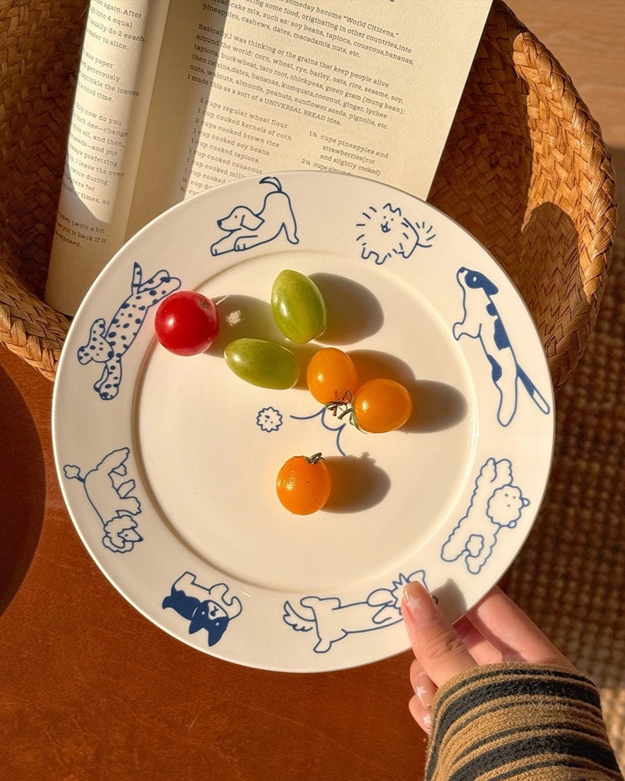 Plate with colorful gummy fruits on a wooden surface with a book in the background
