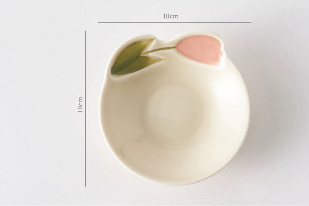 Small ceramic dish with a pink accent on a light gray background