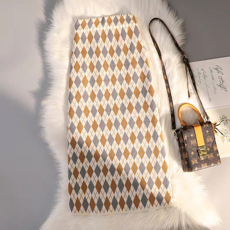 Patterned rug with geometric design on a white surface