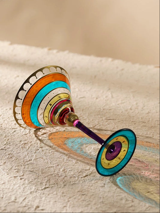 Colorful glass with a unique design on a textured surface