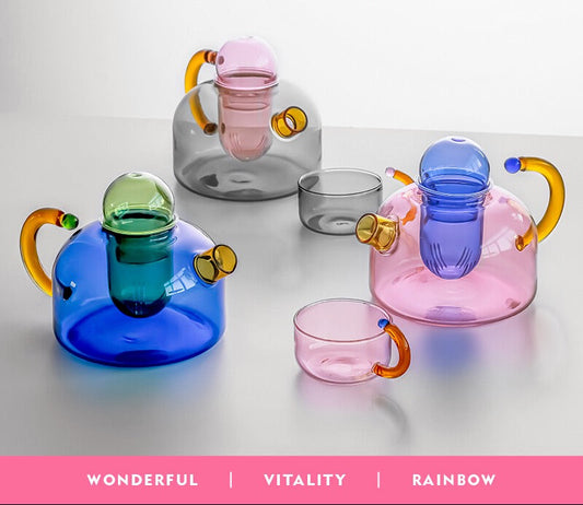 Colorful glass teapots and cups with WVii branding on a light background