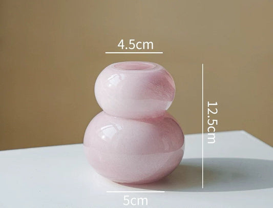 Pink glass vase with measurements on a beige background, featuring the brand Siwa Studios