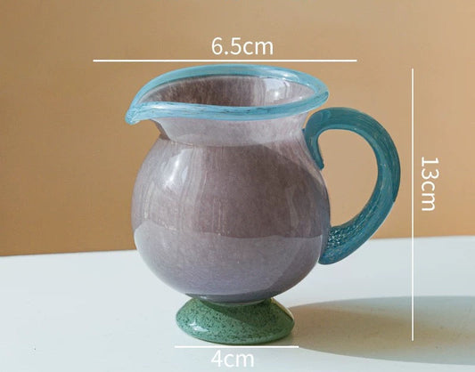 Ceramic pitcher with measurements on a beige background