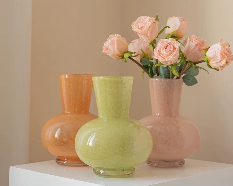 Three colorful vases with flowers on a white surface, featuring 'Banran Home' branding.