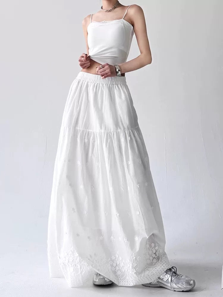 White dress with lace details on a white background