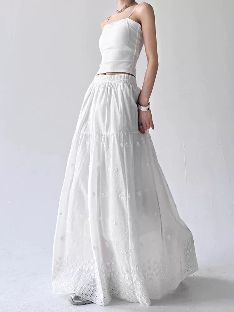 White strapless top and long skirt set on a plain background