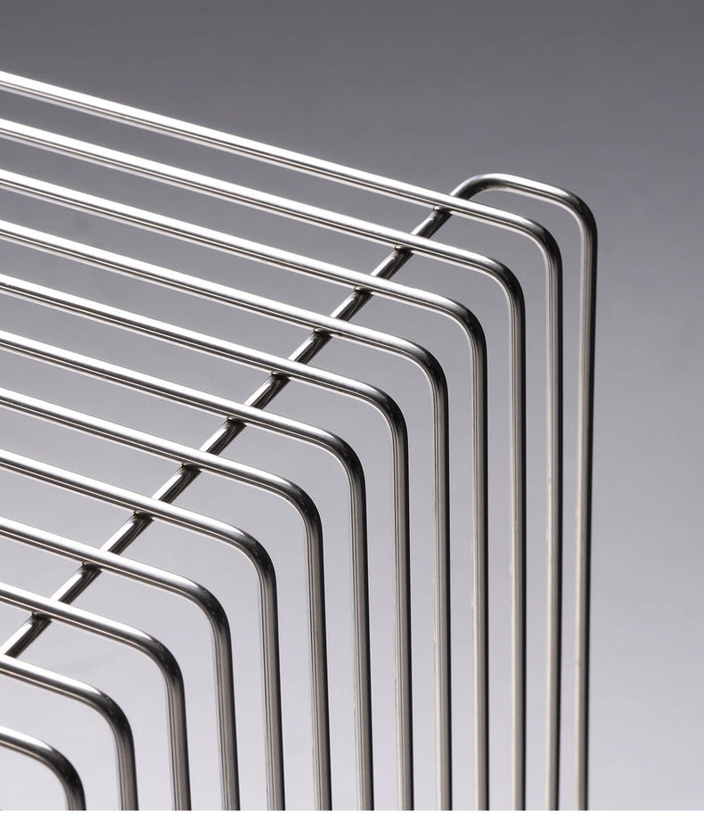Stack of metal cooling racks on a gray background