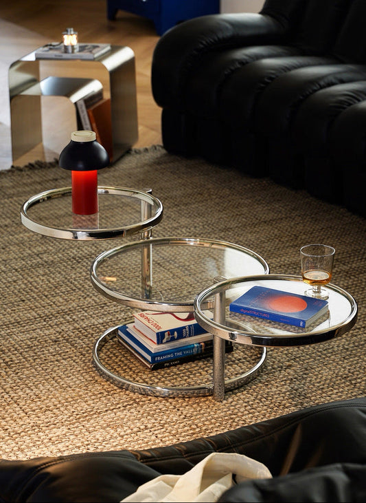 Modern coffee table with glass top in a living room setting