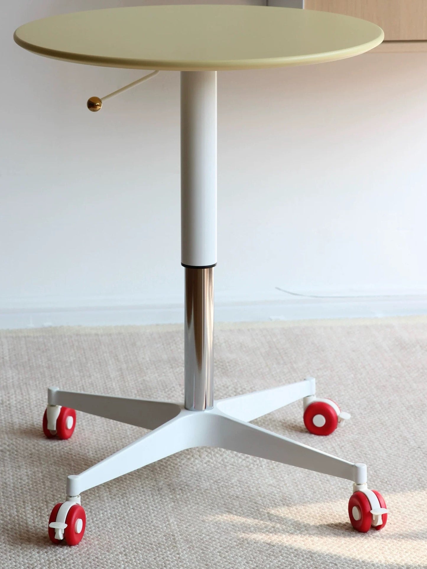 Round adjustable table with wheels on a plain background, featuring 'today home' branding.