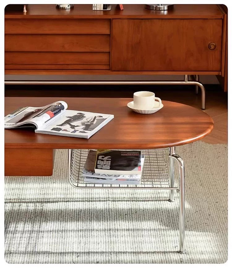 Wooden coffee table with a magazine and cup in a living room setting