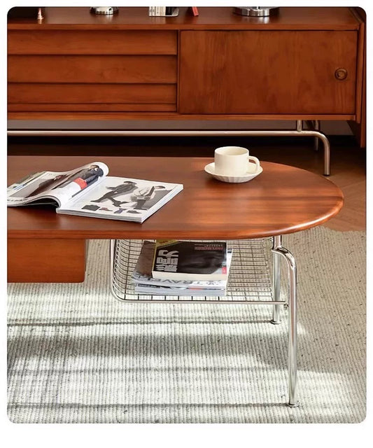 Wooden coffee table with a magazine and cup in a living room setting