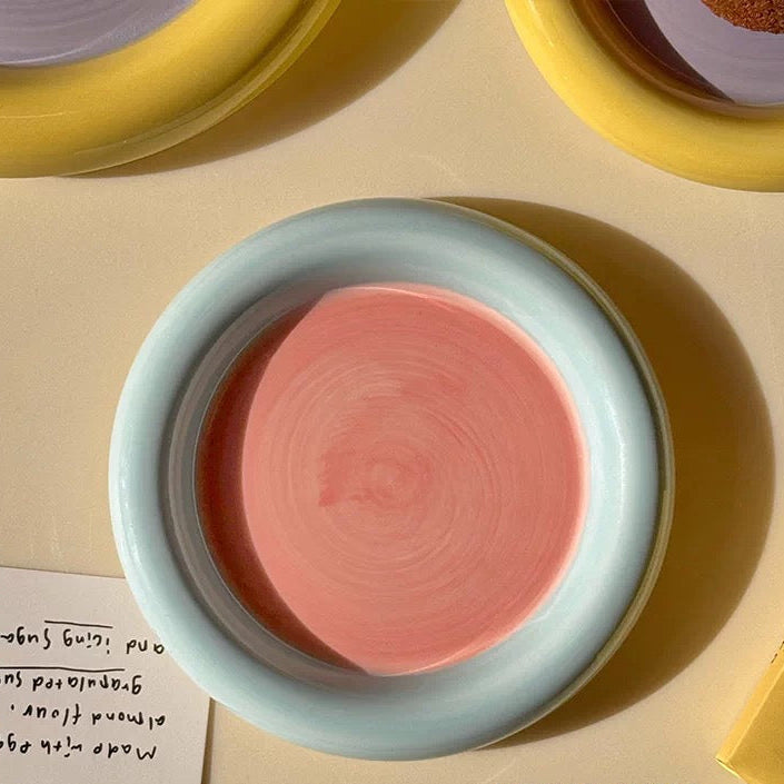 Pink ceramic dish on a beige surface with text overlay